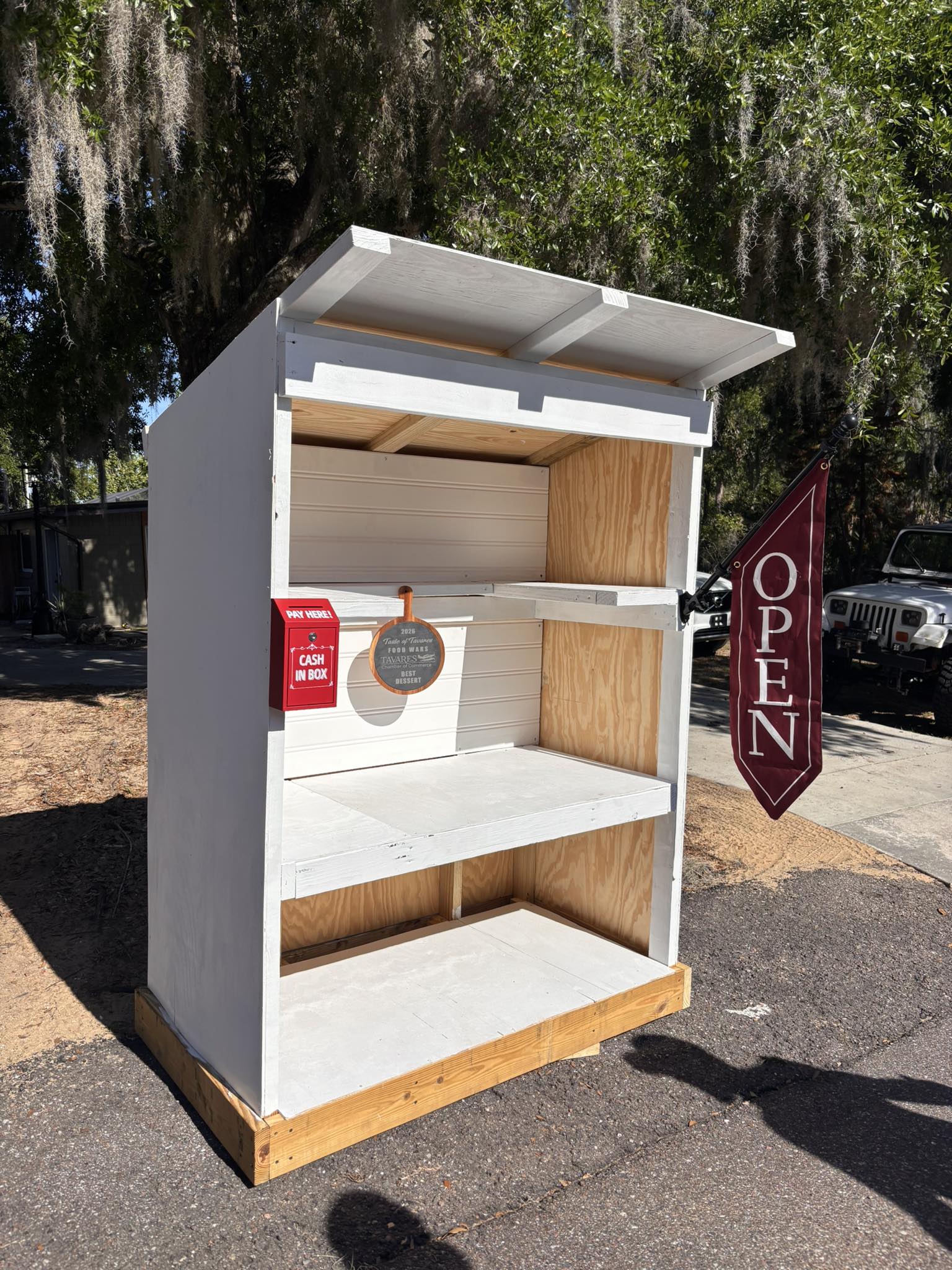 The Little Farm Stand roadside booth with the OPEN flag